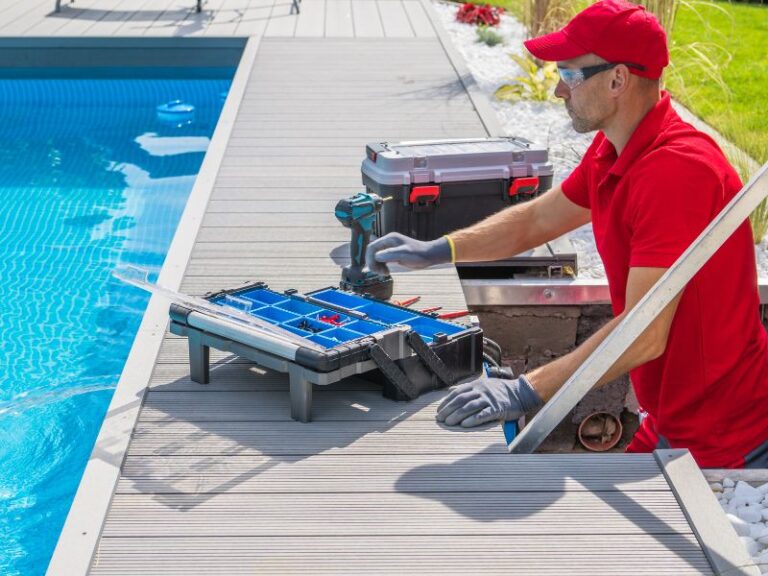 Man in red shirt maintaining a pool